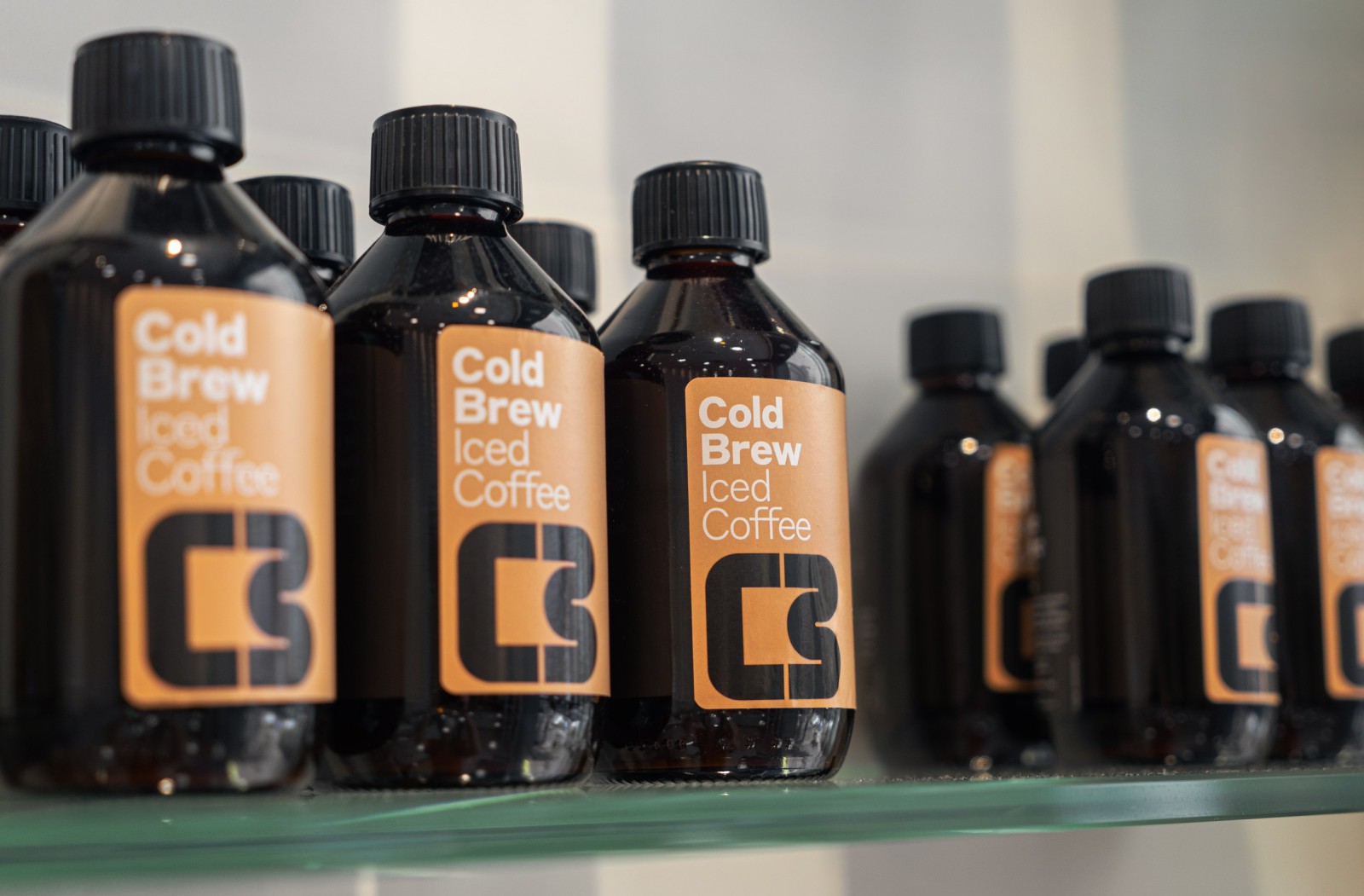 Cold Brew Iced Coffee bottles on the shelf at the Pure Pastry Store